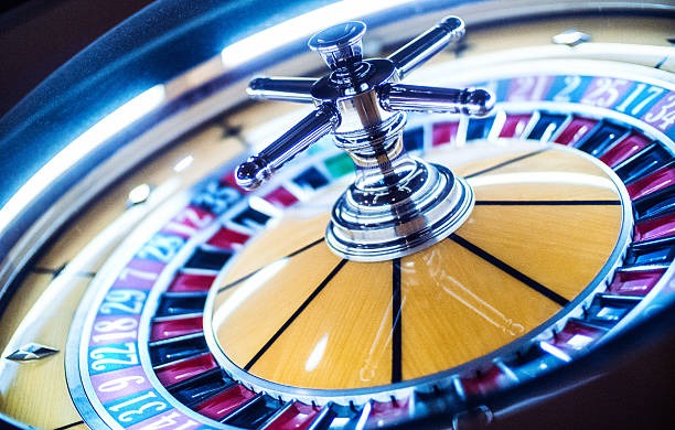 Mobile phone displaying live blackjack table with dealer video and betting interface
